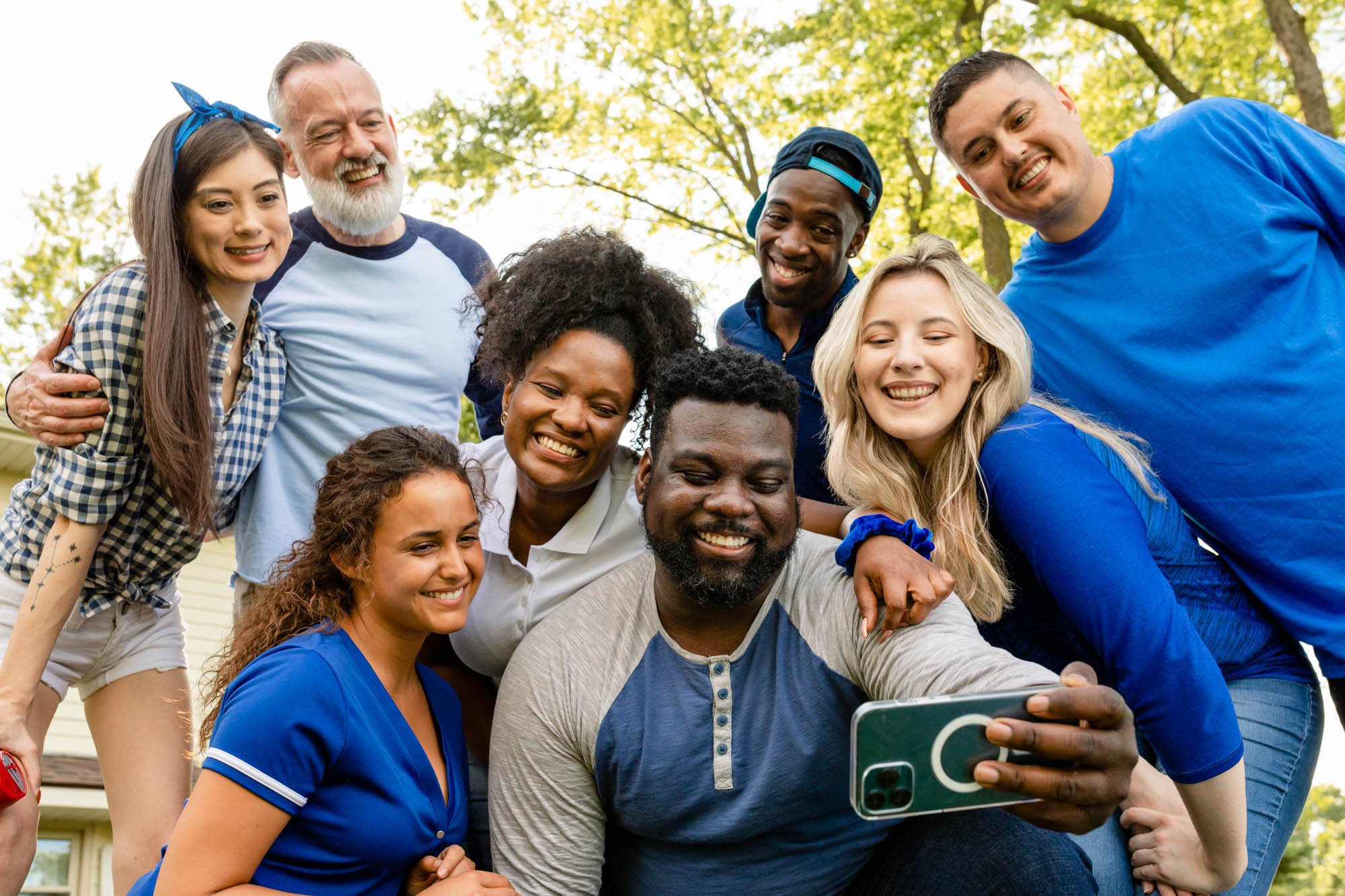 friends taking a selfie at a tailgate party